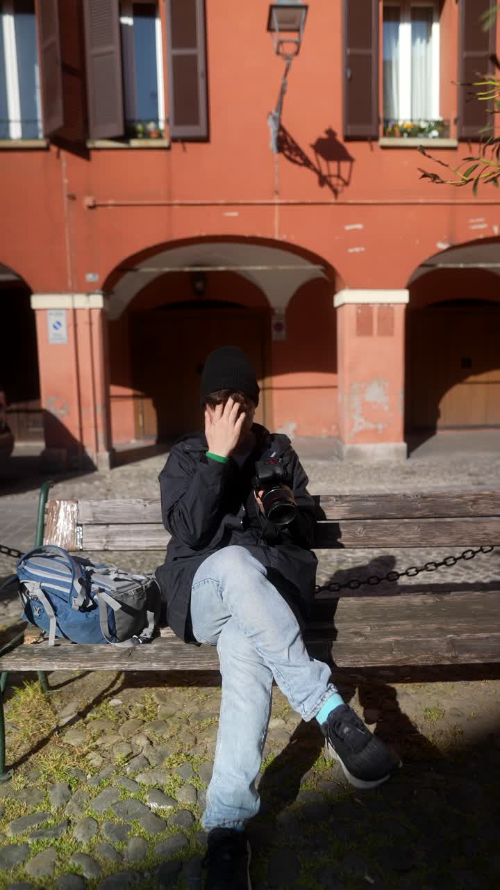 Photographer taking pictures in an Italian square