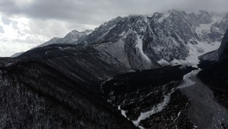 aerial: yulong old glacial valley, jade dragon mountain china, black and white