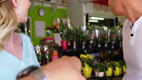 Customer-pointing-at-flower-in-flower-shop