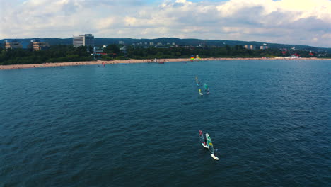 aerial view of windsurfing on the blue water of baltic sea in poland