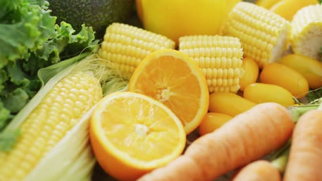 video of fresh fruit and vegetables over wooden background