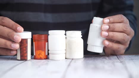 person holding medicine bottles