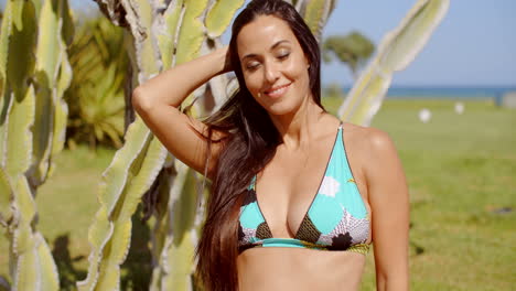 Happy-Woman-in-Beach-Wear-Looking-at-Camera