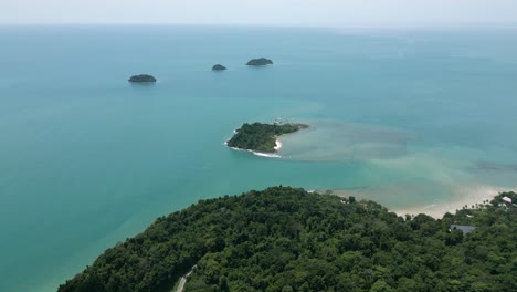 aerial scenic nature drone footage of the mountains and beaches on the tropical island of koh chang in thailand on a sunny day