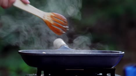 Smoke-rising-from-skillet-in-campground