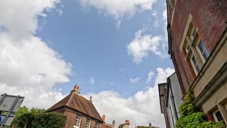 people walking on a charming english street