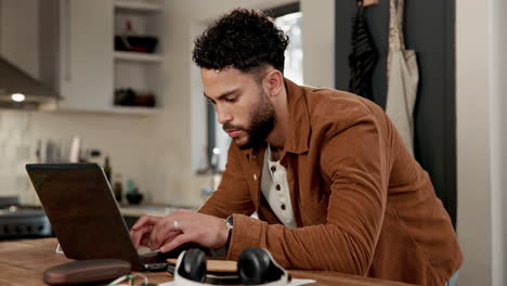 man working from home kitchen