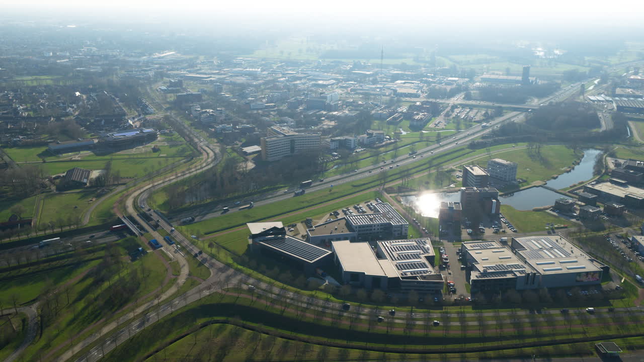 Aerial view of highway interchange beside modern warehouses in Netherlands
