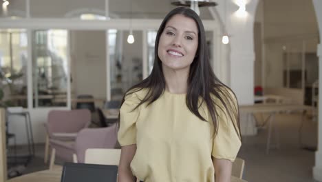 cheerful pretty black haired young woman