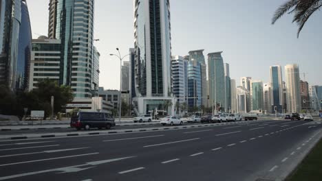 doha cor-niche at sheraton park daylight view showing west bay skyscrapers and cars in the street .