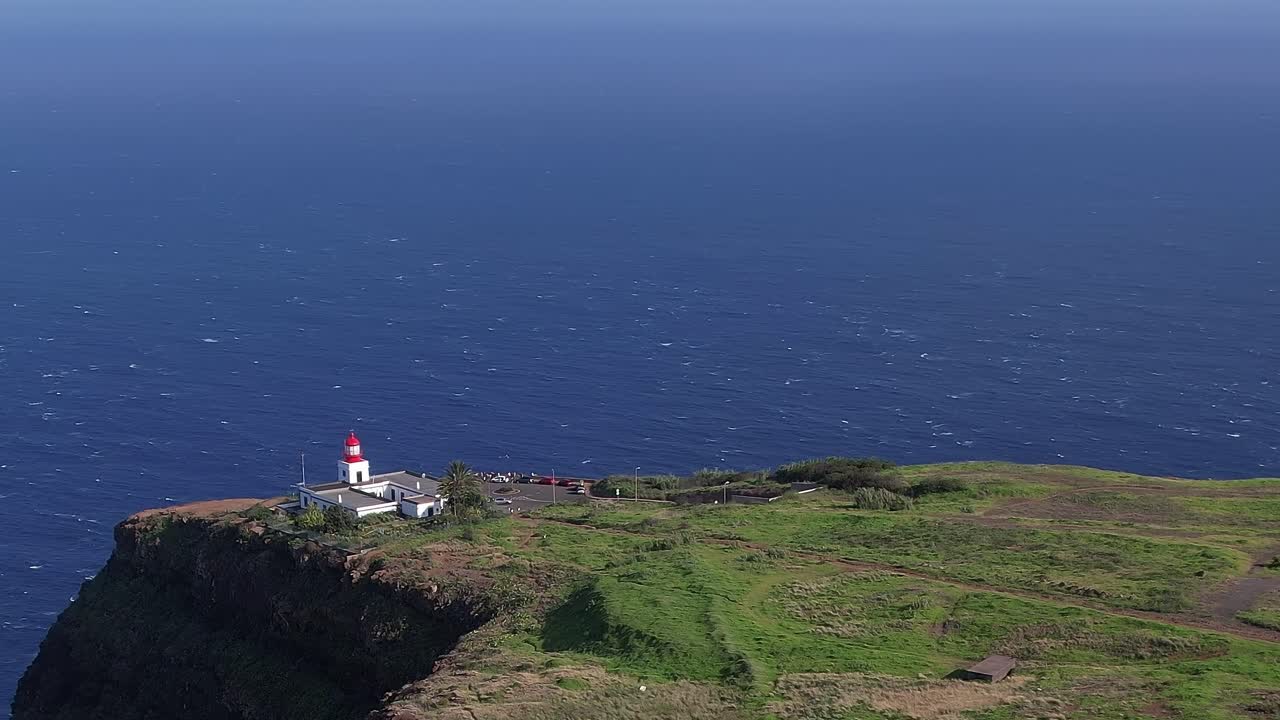 Scenic aerial view of Madeira's coastline with lighthouse and ocean