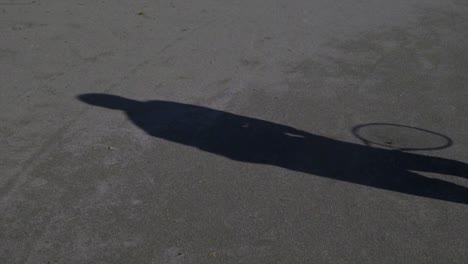 the shadow of a tennis player when he makes a serve in tennis