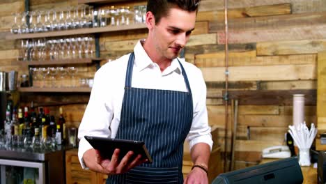 male waiter working at counter