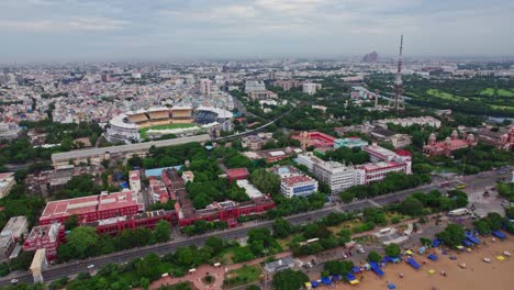 public works department building with pwd estate background m.a. chidambaram stadium and university of madras in chepauk, triplicane, chennai, tamil nadu day time push in drone shot