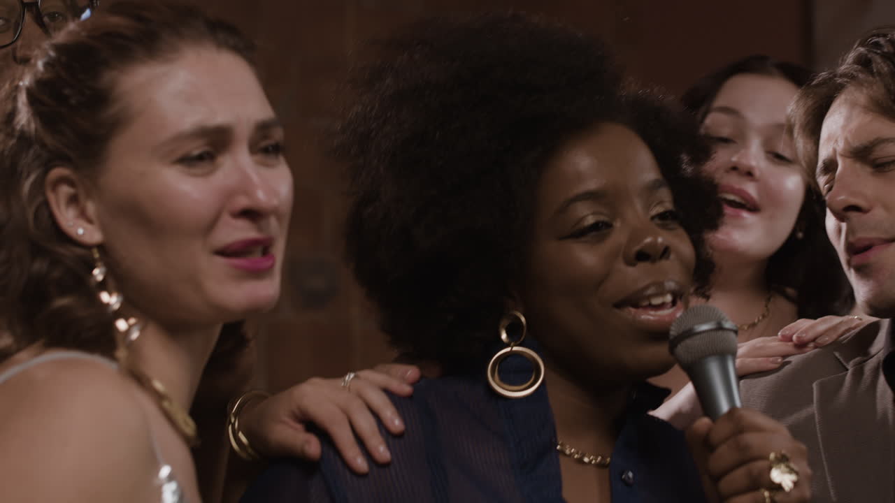 Group of friends singing karaoke