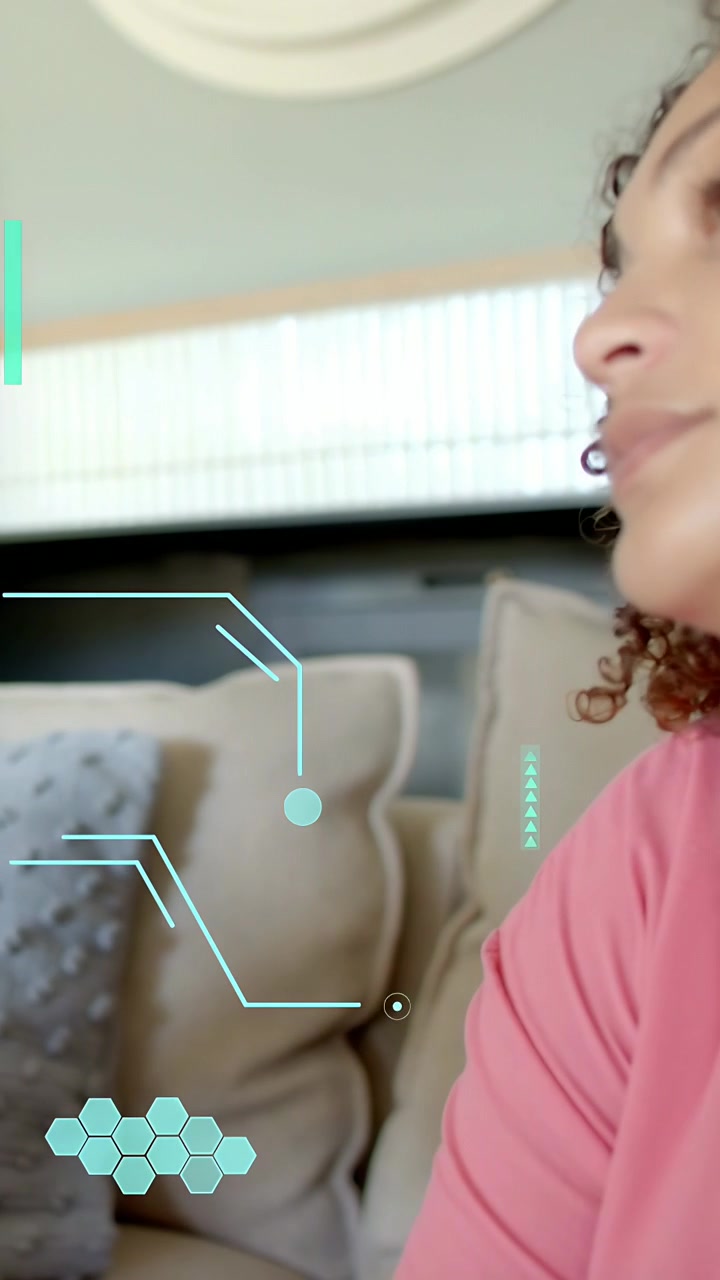 Vertical video: Woman speaking on couch, explaining tech while teal hex overlays matching gestures