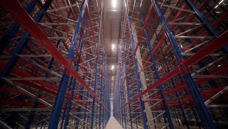 big and modern warehouse under construction, featuring metal shelving and other industrial equipment.