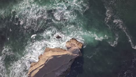 static aerial view above showing greyhound rock beach