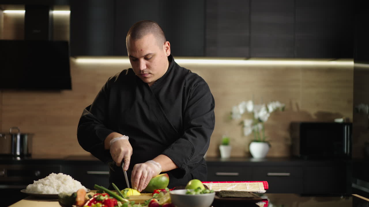 Chef Preparing Ingredients for Sushi in a Modern Kitchen