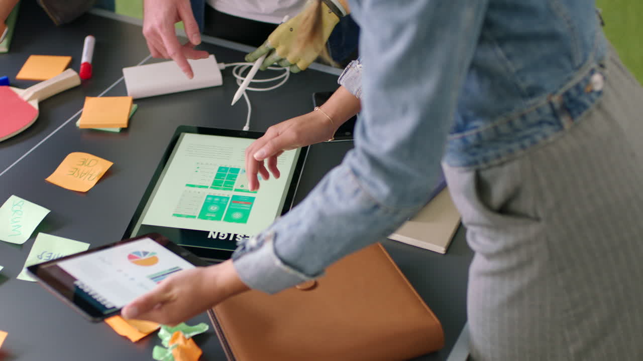 Tablet data, sticky notes and business people