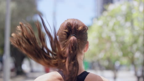 Rear-view-Athletic-running-fitness-woman-in-urban-city-slow-motion