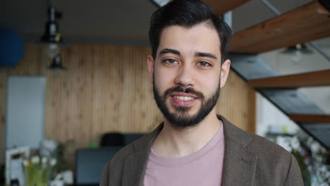 portrait of a smiling man in an office setting
