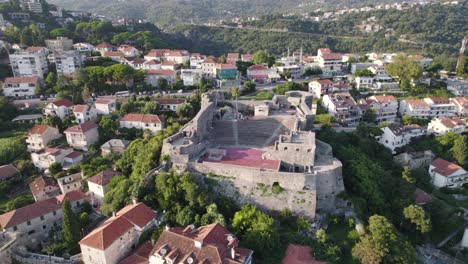 aerial: kanli kula fortress amidst herceg novi, montenegro's landscape