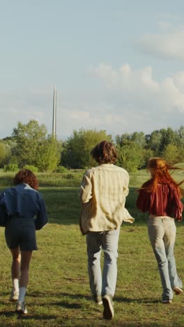 friends running through a park