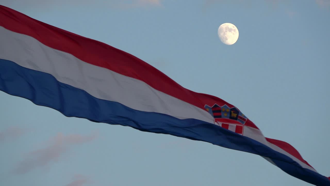 4K. Croatian flag is waving in the wind. It's getting dark