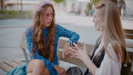 two women talking outdoors