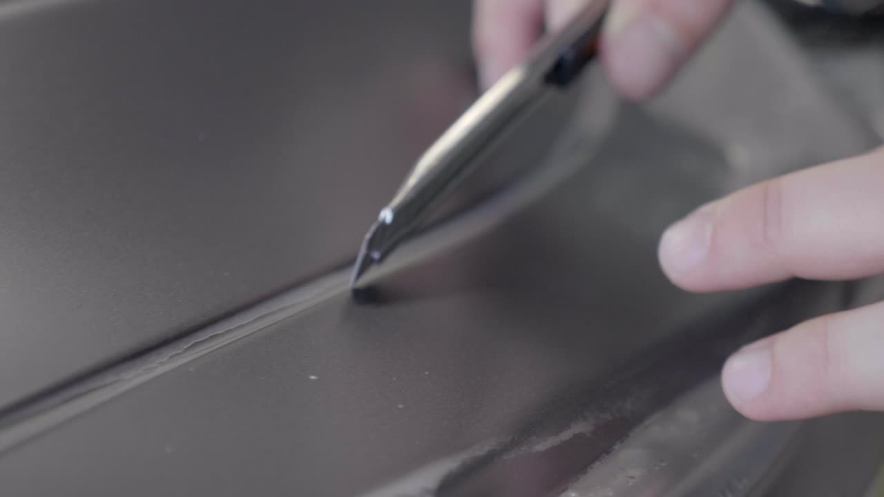 Incision in Paint Protection Film on Car's Exterior