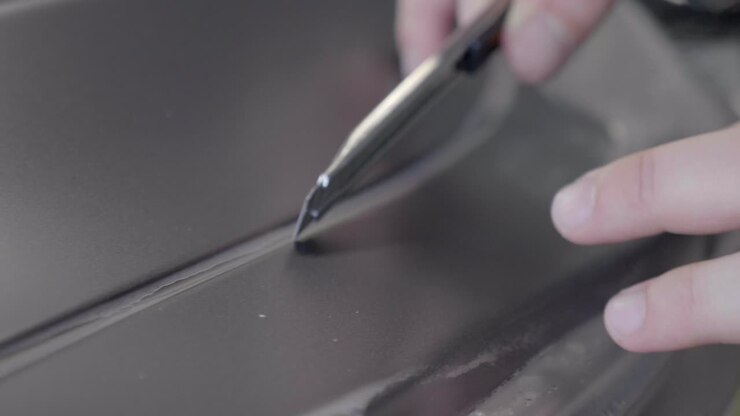 Incision in Paint Protection Film on Car's Exterior