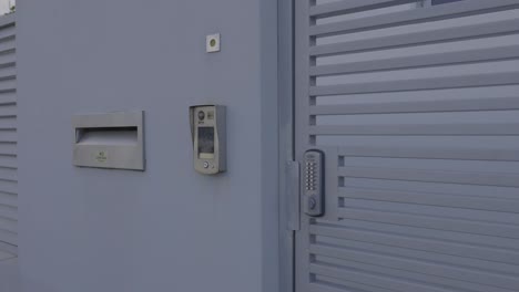 doorbell and mail slot on a gate