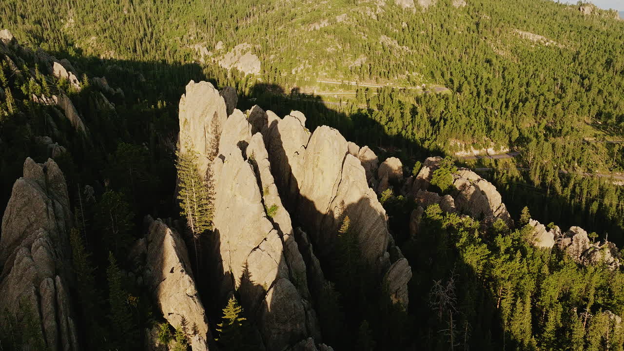 Drone shot gliding over rugged rock landscapes sculpted by erosion in the western U.S.
