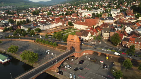 aerial view of a historic european town with bridge and city gate
