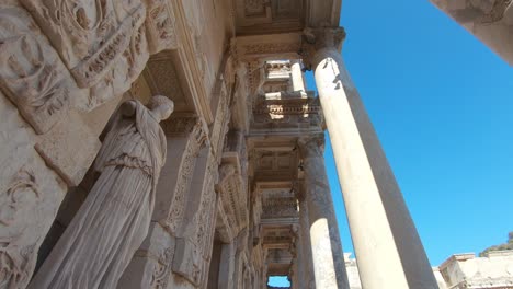 upward panning, detail facade of the celsus library in ephesus, with statue represents sophia the wisdom