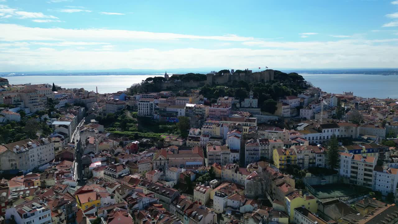 Flying over the Lisbon city towards Sao Jorge Castle with tejo river at background,lisbon,Portugal