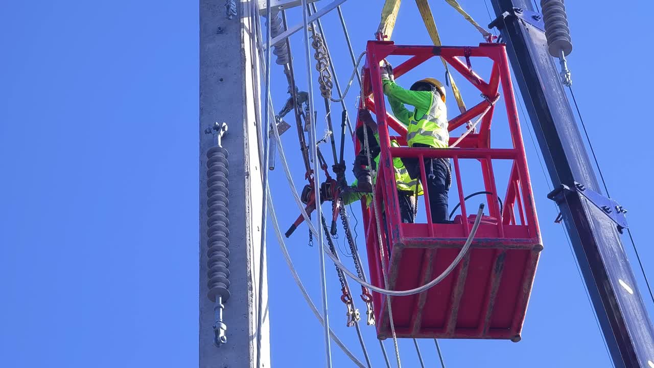 Utility Workers Repairing Power Lines