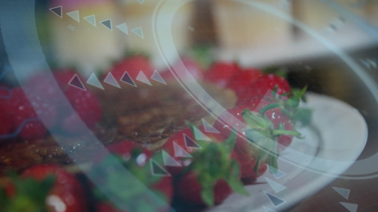 Digital interface animation overlaying strawberries on plate in vibrant display