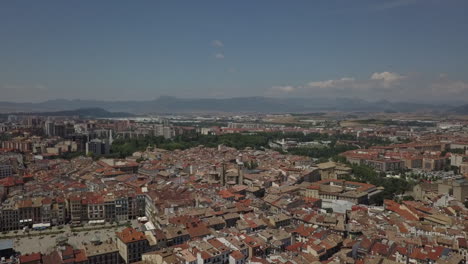 rising aerial overlooks sunny pamplona spain, running with the bulls