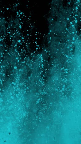super slow motion shot of cyan color powder explosion at 1000fps vertical view