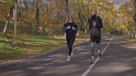 couple running in autumn park