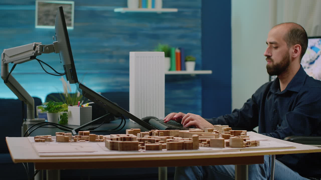 Disabled architect using touch screen monitor for construction