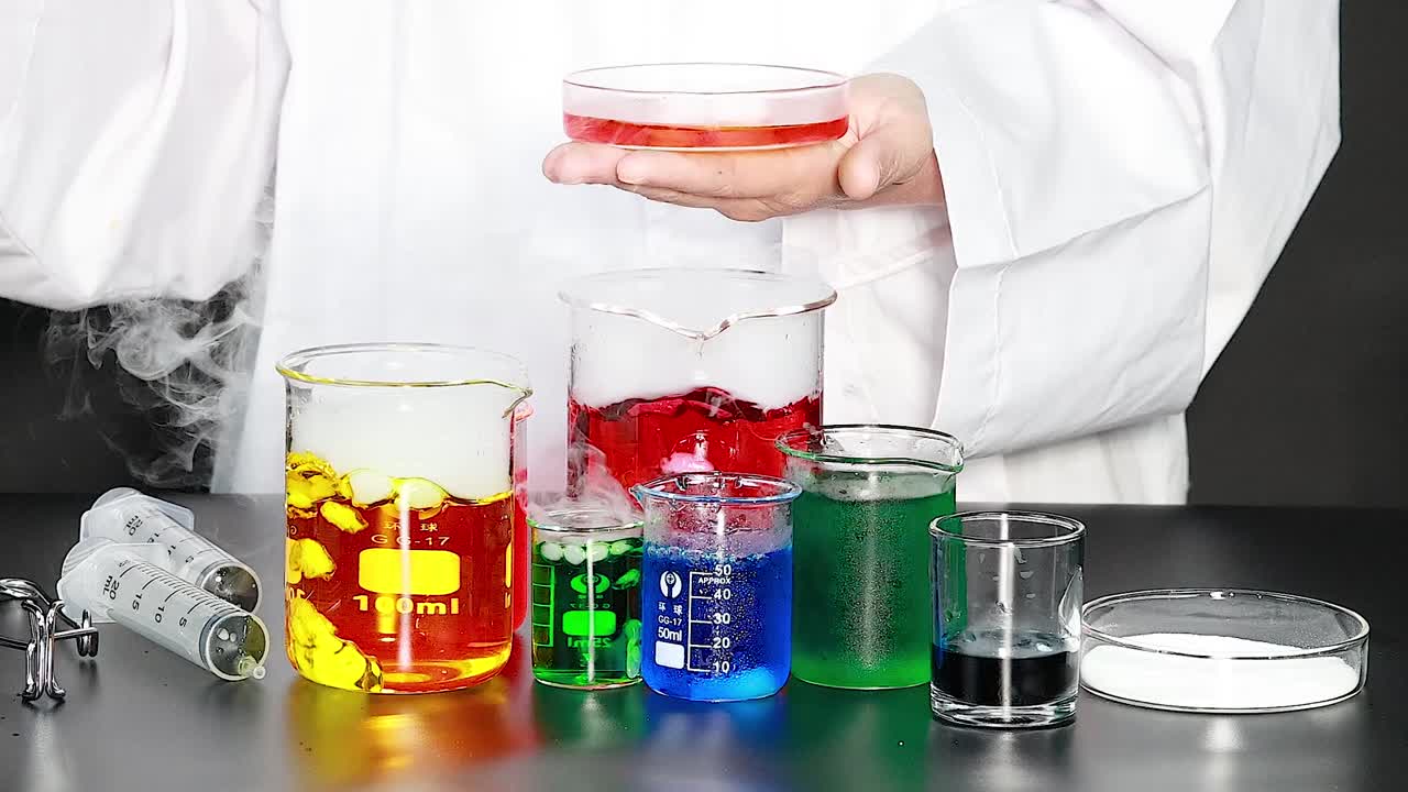 A scientist observes colorful liquid reactions in beakers, creating smoke and vibrant visual effects.