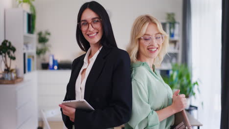 Confident-Successful-Female-Coworkers-Portrait-in-Office