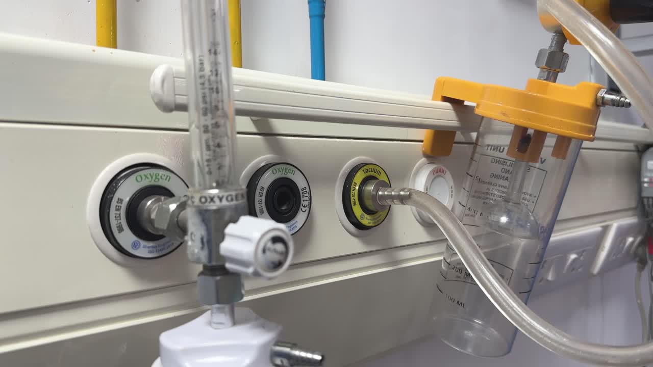 Closeup of hospital room outlets for medical gases like oxygen and vacuum, The panel is designed to provide a safe and efficient way to deliver these services to patients at their bedside
