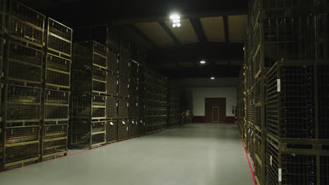 Great-slow-motion-wide-shot-of-a-container-of-wine-bottles-inside-a-wine-factory-in-Burgos,-Spain