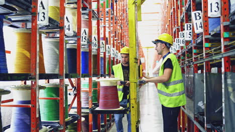 interior of modern production line. workers in electrical cable production factory