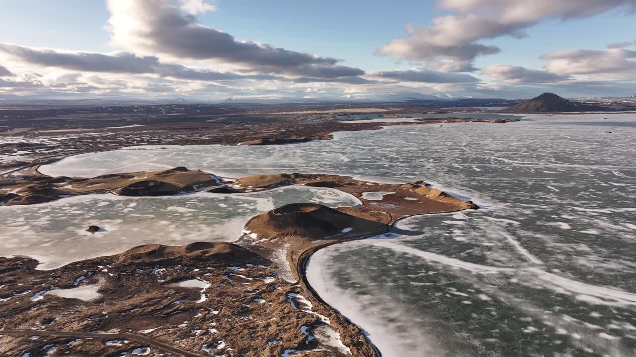 Frozen Lake Mývatn with volcanic pseudocraters near Skútustaðir in Reykjahlíð. Iceland