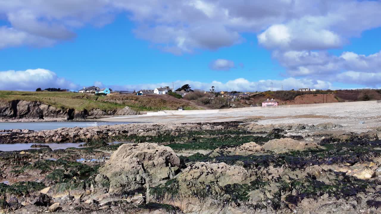 Annestown Beach Copper Coast Waterford at low tide exposing golden rocks on a spring day